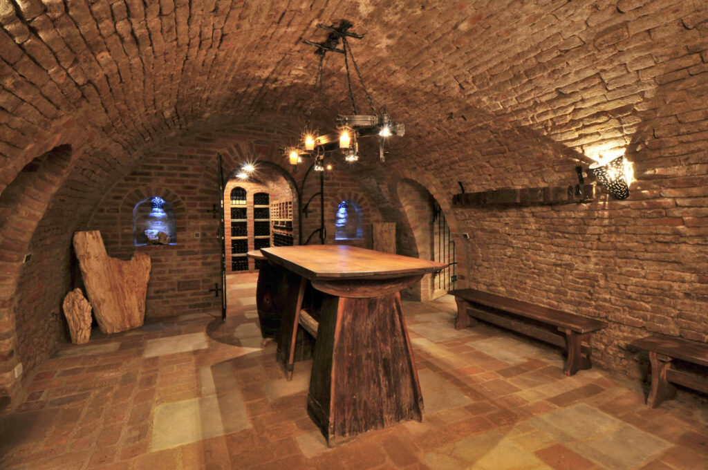 Valtice underground space with a large table in the middle of the room